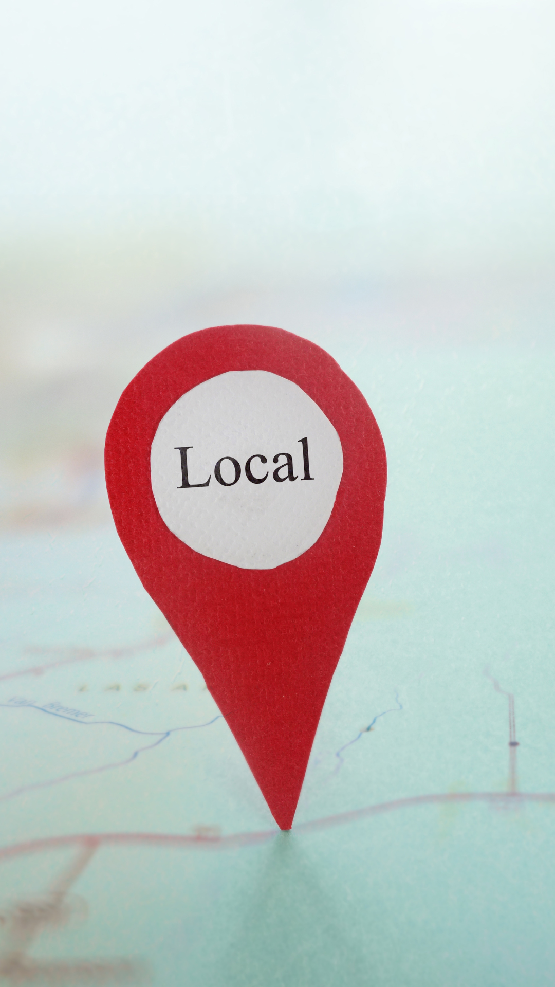 A visually appealing representation of local SEO with location pins, a magnifying glass, and NAP details prominently displayed.